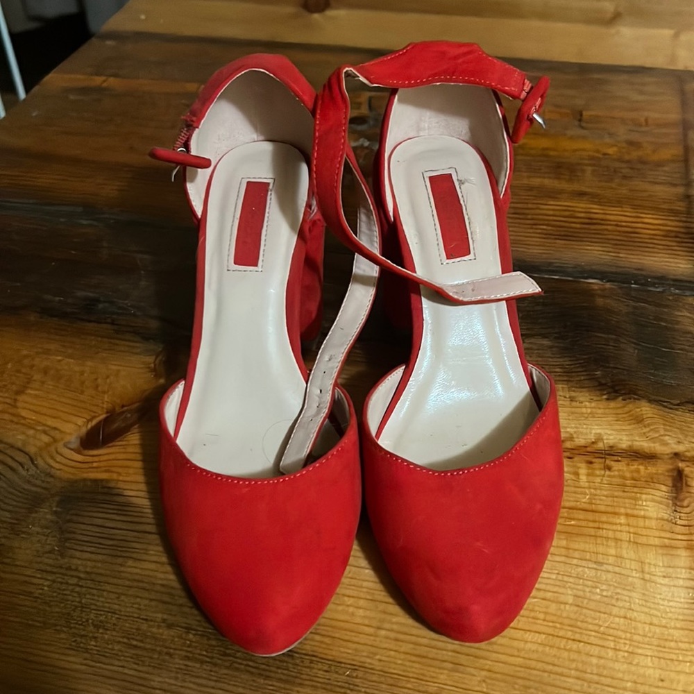 Red close toed pumps